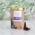 Backflow Incense Cones container with lavender cones on a light background