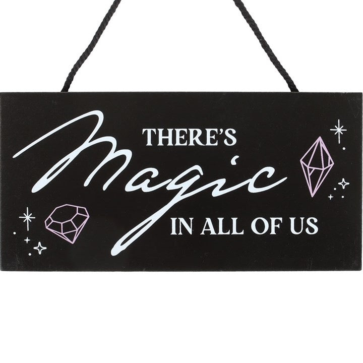 Crystal witch hanging sign with magical text detail — close up
