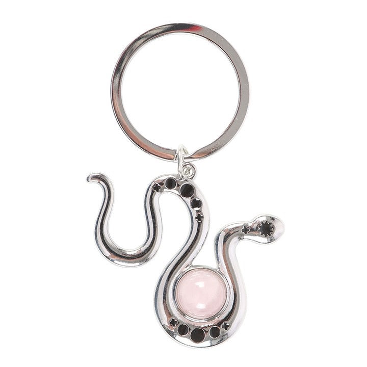 Serpentine keychain with a pink gemstone on a white background