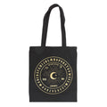 Black tote bag with gold Ouija board design on a white background