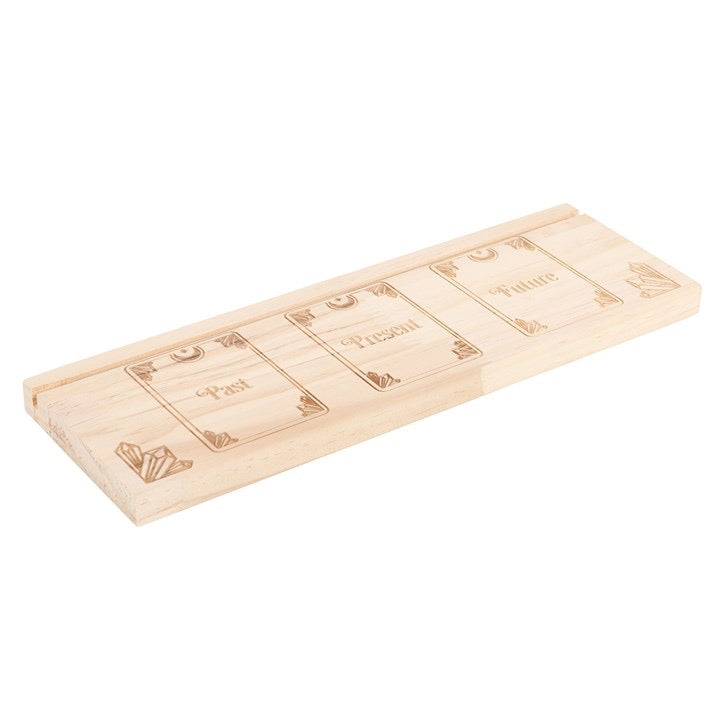Wooden tray with engraved text on a white background