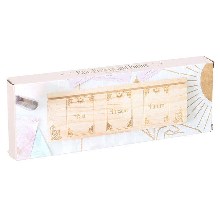 Wooden fortune teller with 'Past', 'Present', and 'Future' cards in a box on a white background