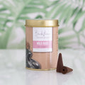 Backflow Incense Cones Wild Rose packaging with incense cones on a light background