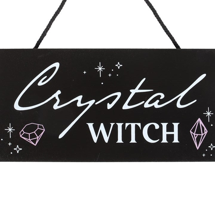 Crystal Witch hanging sign with text detail — close up