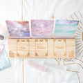 Set of tarot cards labeled 'Past', 'Present', and 'Future' on a decorative background.