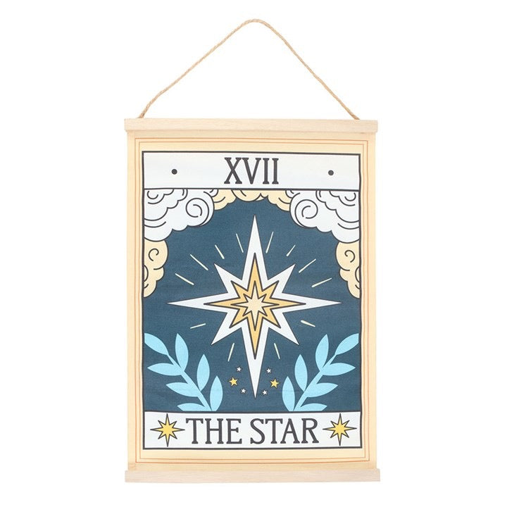 Decorative wall hanging with star design and 'The Star' text on a white background