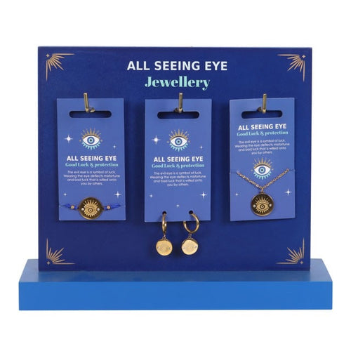 All Seeing Eye jewellery display with necklaces and earrings on blue stands.
