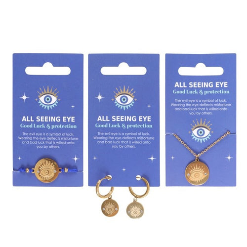 Three sets of 'All Seeing Eye' jewelry on blue cards with text.