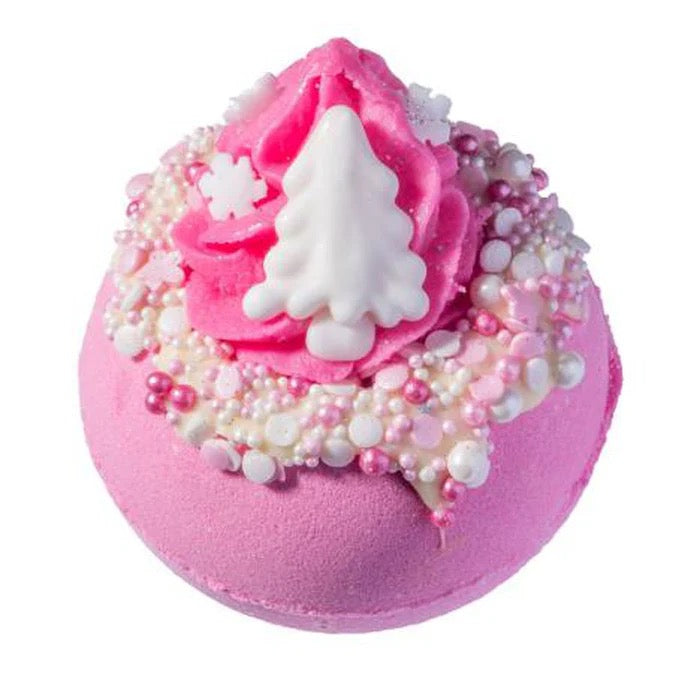 Pink bath bomb with white tree decoration on a white background
