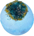Blue bath bomb with a textured surface and embedded materials on a white background