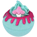 Colorful bath bomb with a mushroom design on a white background