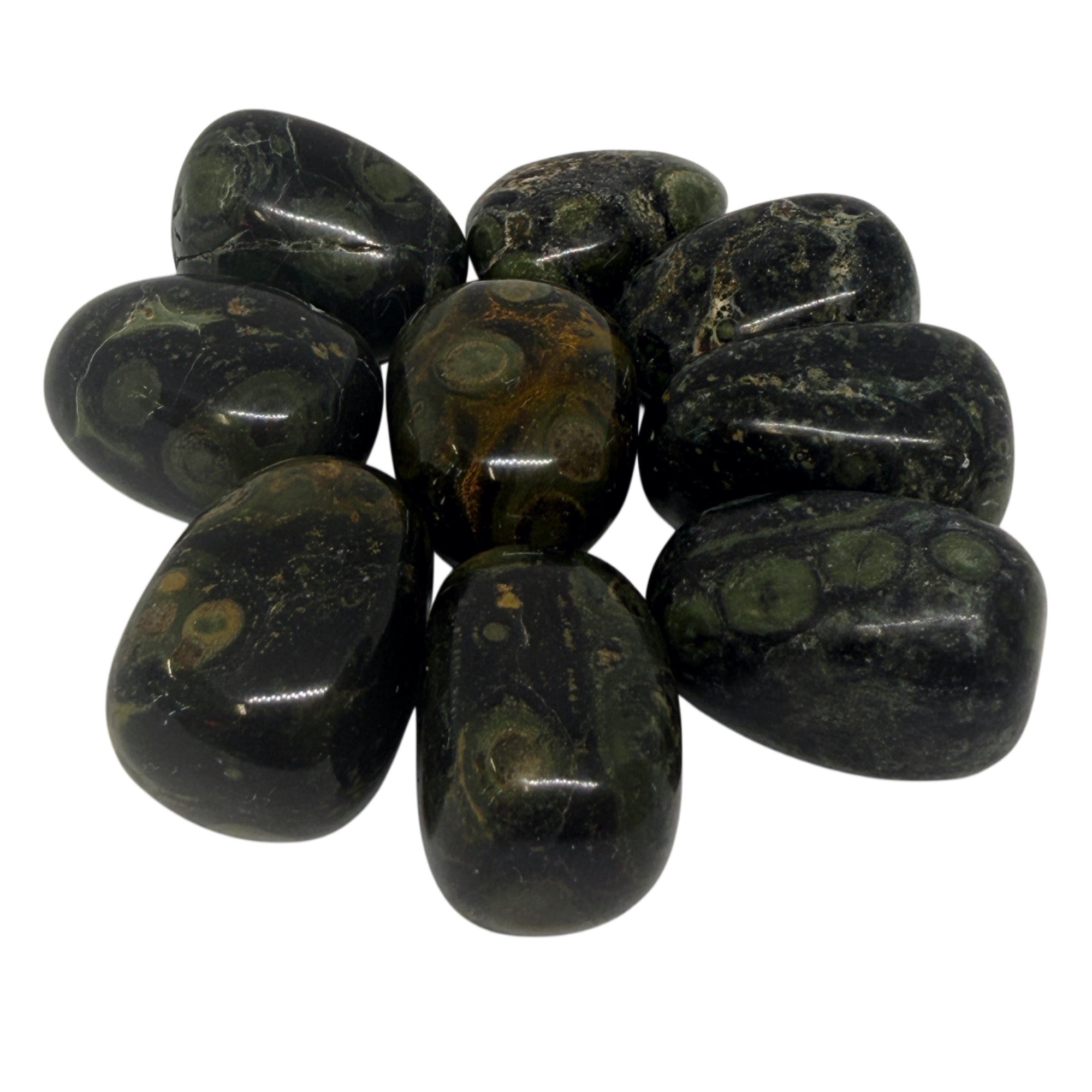 Group of polished dark green stones on a white background