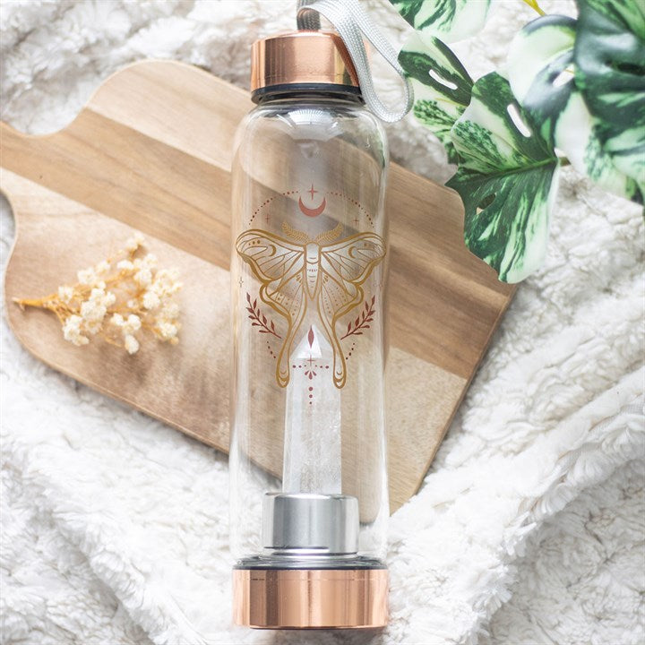 Luna moth glass water bottle with clear quartz crystal point in base and black screw-top lid