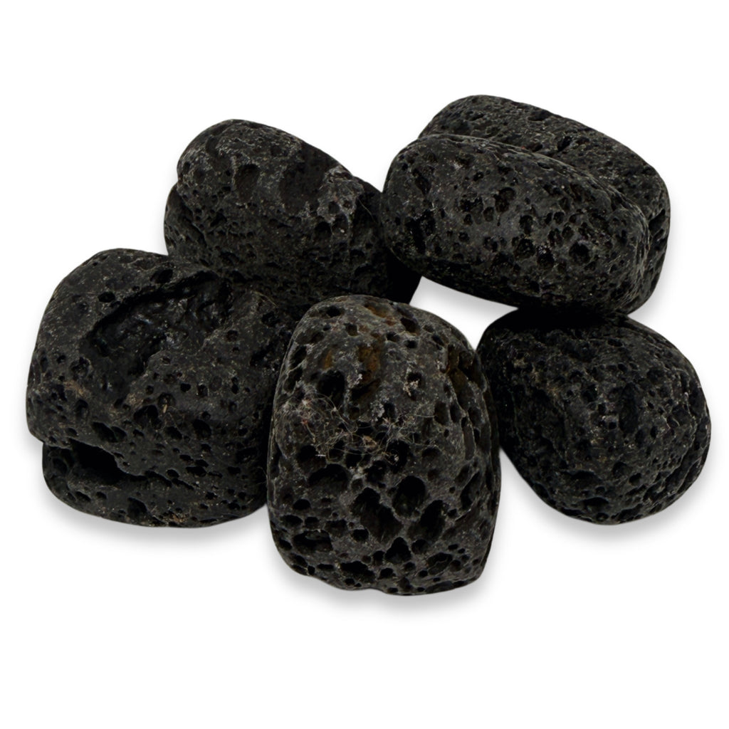 Black volcanic pebbles on a white background