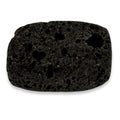 Black volcanic stone with a porous texture on a white background