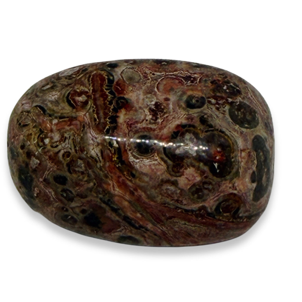 Marbled stone with brown, black, and red colors on a white background