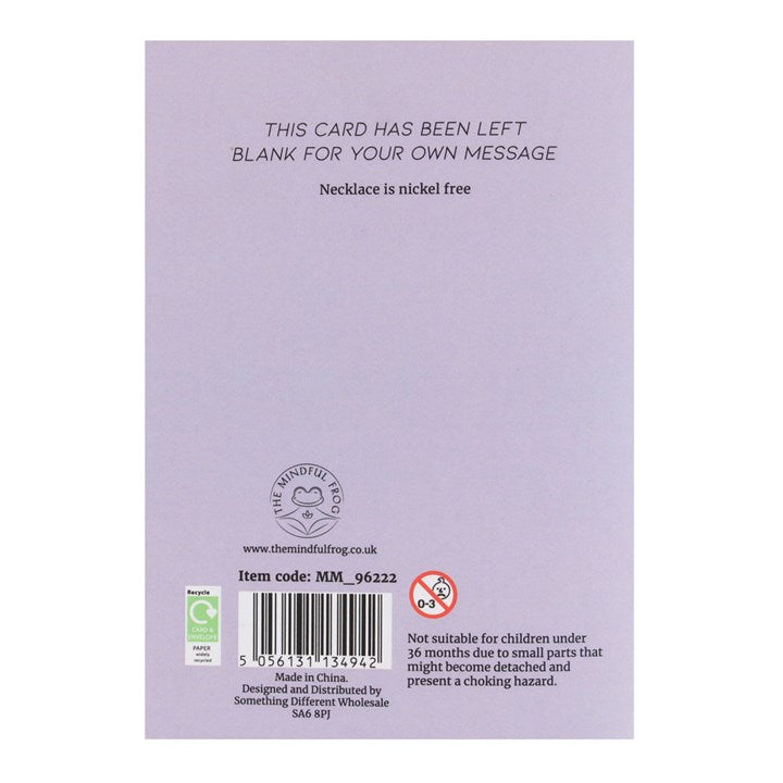Back of a product packaging with text and branding on a light purple background