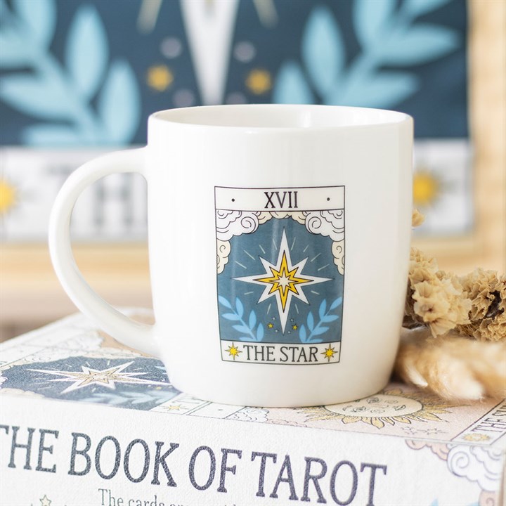 Mug with 'The Star' tarot card design on a book titled 'The Book of Tarot'.