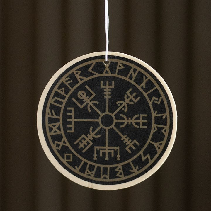 Round decorative item with Runes design on a dark background