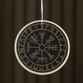 Round decorative item with Runes design on a dark background