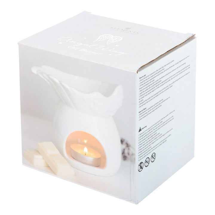 White candle in a box with a clear lid on a white background