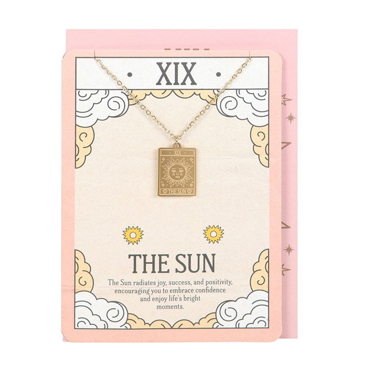 Necklace with a pendant on a decorative card with 'XIX' and 'The Sun' text.
