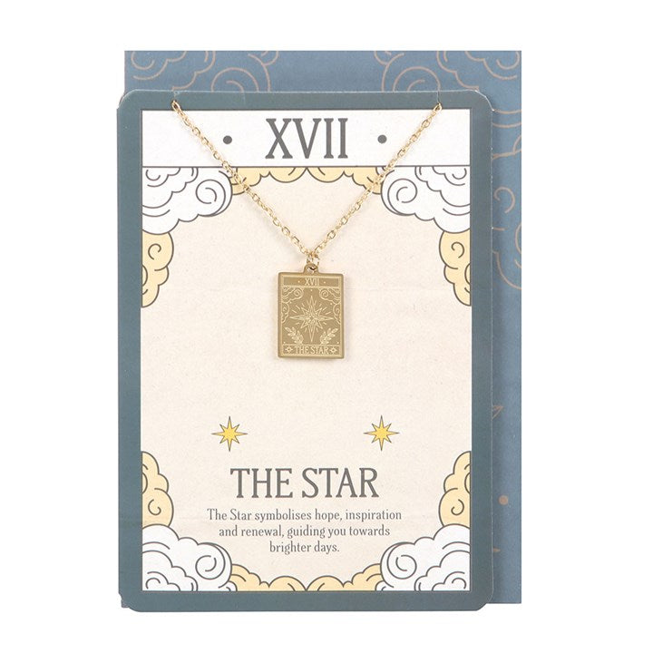 Gold necklace with a pendant on a decorative card