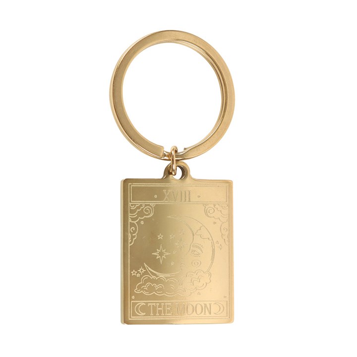Gold keychain with 'The Moon' tarot card design on a white background