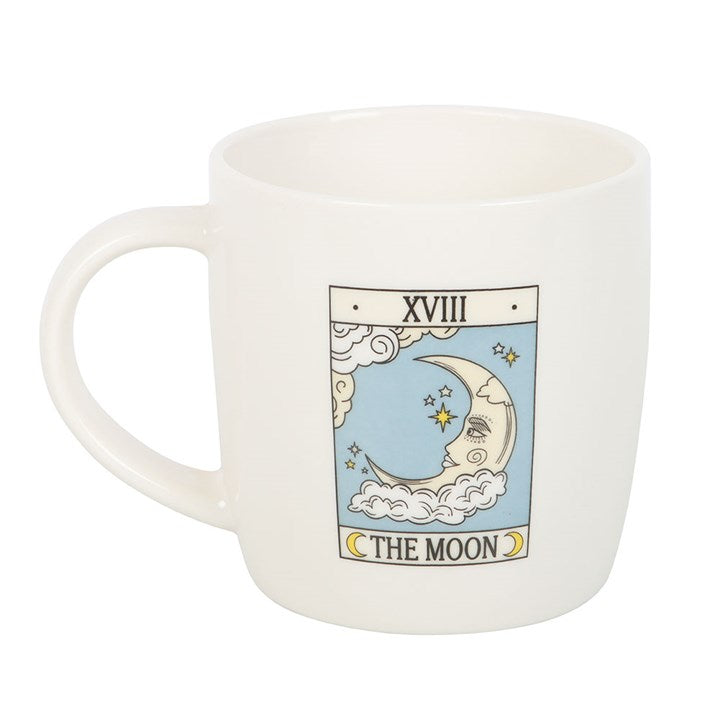 White mug with 'The Moon' tarot card design on a white background