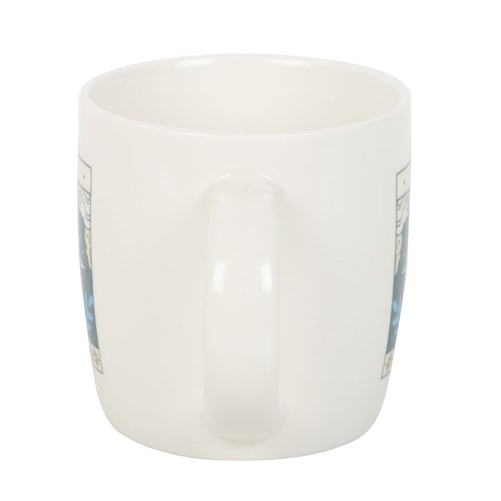 White ceramic mug with floral patterns on a white background