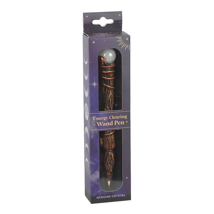 Energy clearing wand pen in packaging with purple background
