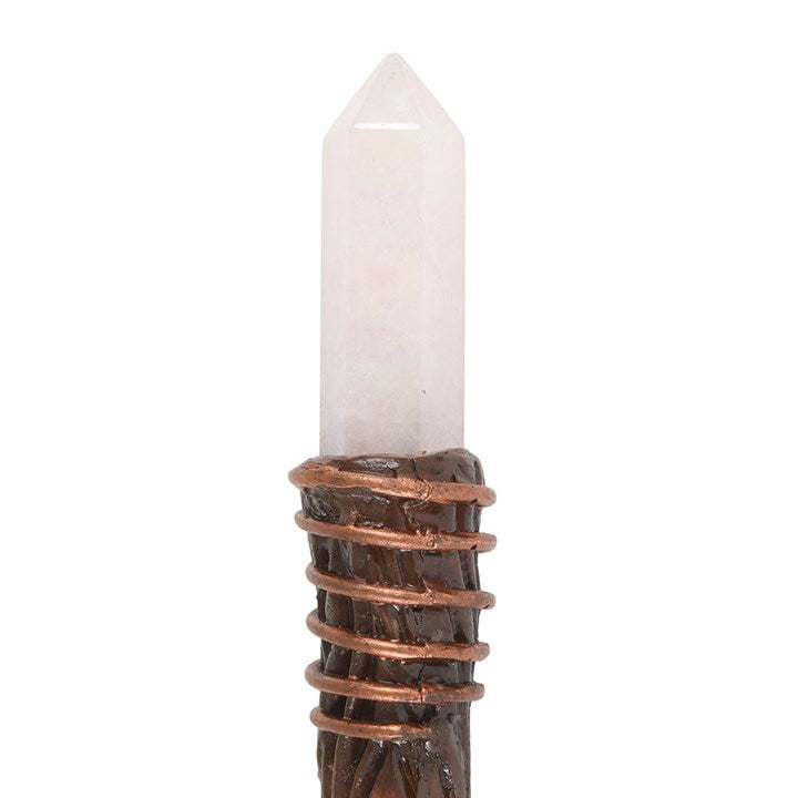 Crystal wand with copper wrapping on a white background