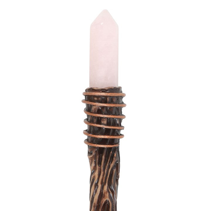 Candle with a wooden and copper holder on a white background