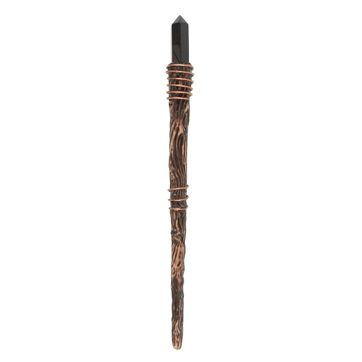 Decorative wand with a black top and wooden handle on a white background