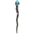 Decorative staff with a blue gem and intricate design on a white background