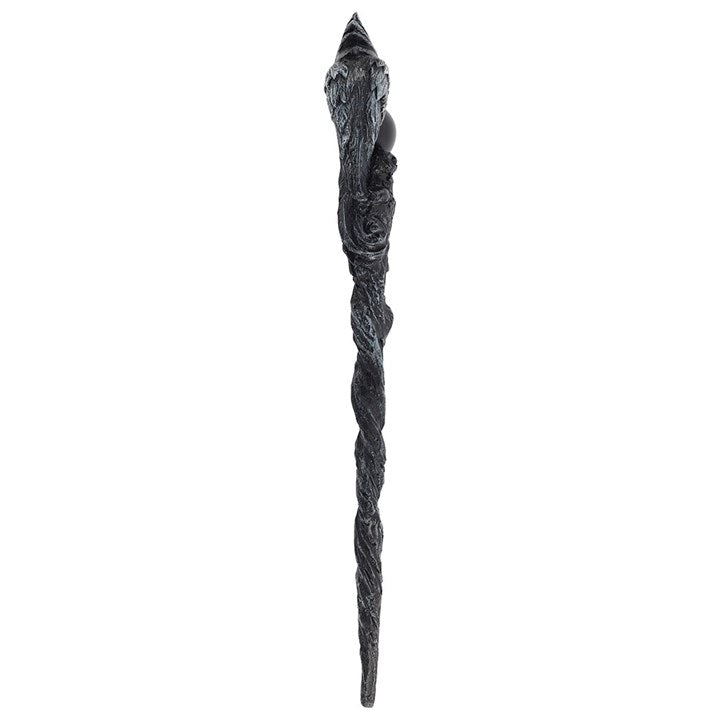 Decorative black wand with intricate design on a white background