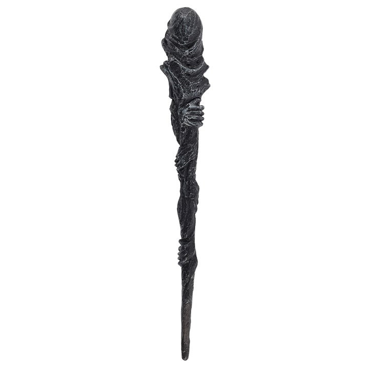Decorative black staff with intricate design on a white background