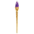 Hair stick with purple crystal and face design on a white background