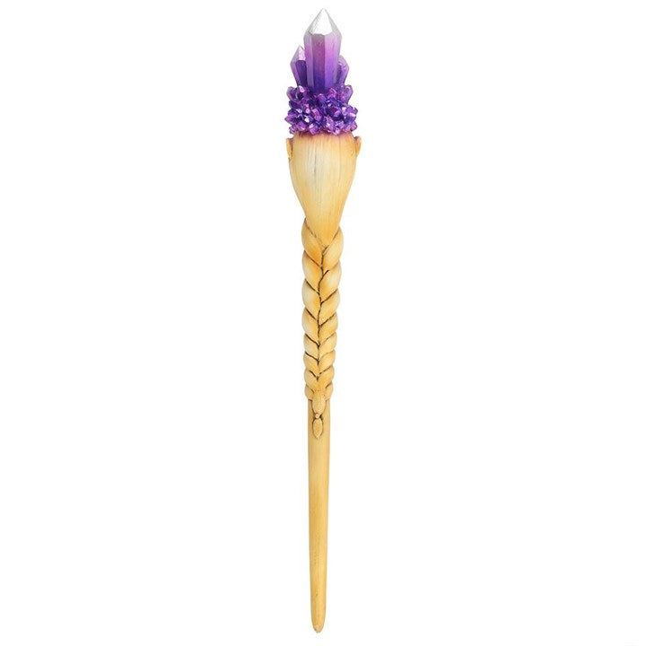 Decorative hairpin with a purple crystal top on a white background