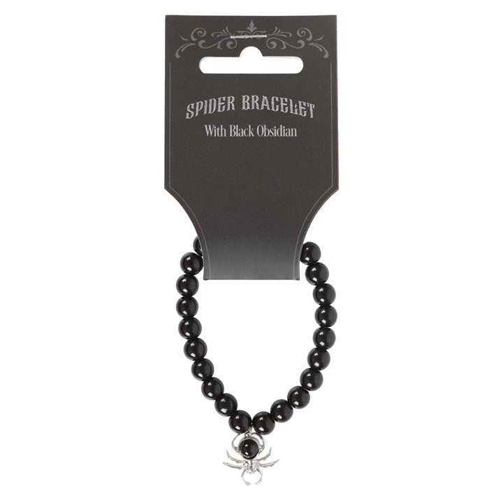 Black beaded bracelet with spider charm on a black card packaging.