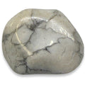 Polished stone with a marbled pattern on a white background